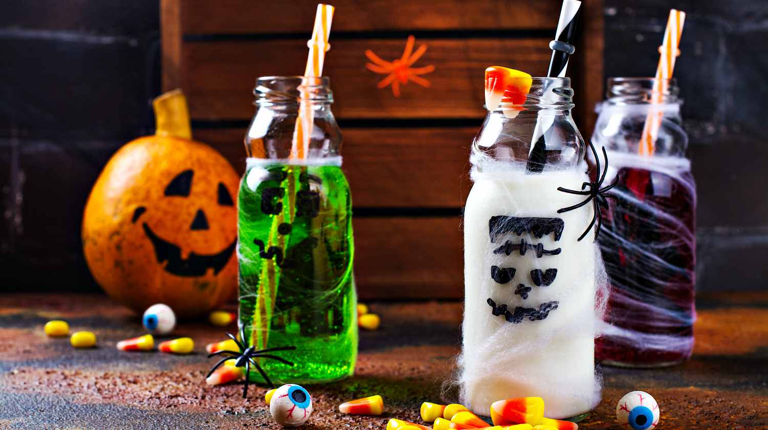 Assortment of Halloween drinks on grunge background | Spooky Halloween Drinks For Your Next Halloween Party | Featured
