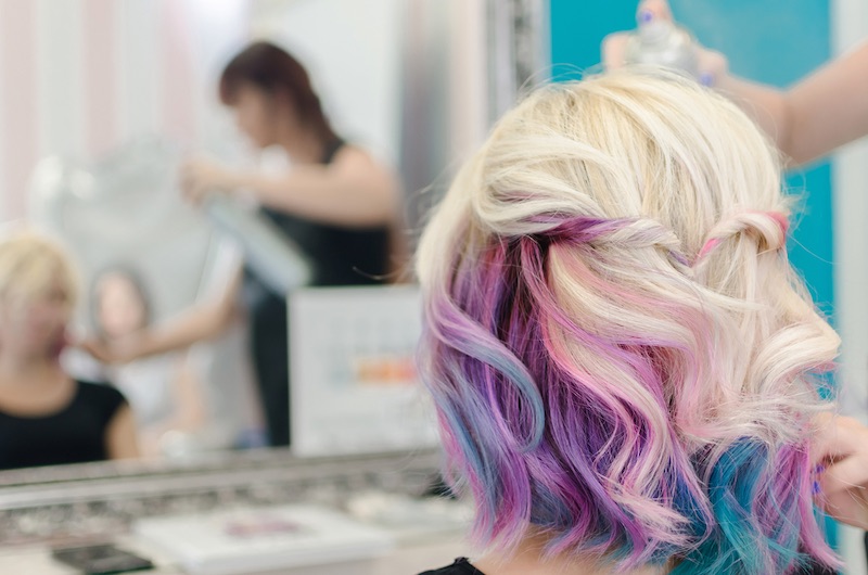 hairdresser-spraying-hair-spray-on-female | fall hair colors