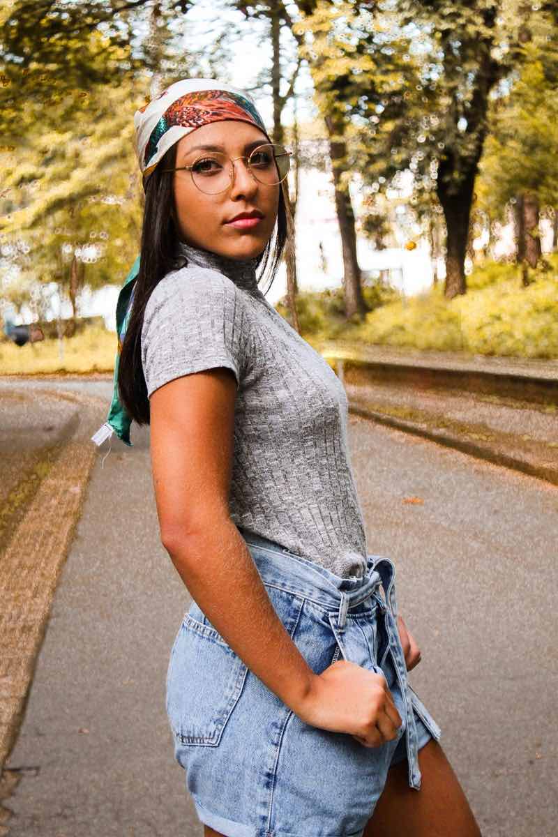 woman-in-gray-top-and-blue-denim-shorts-standing-on-road | fall hair accessories