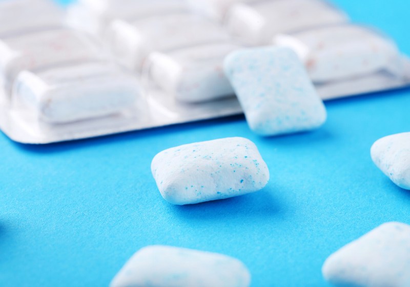 chewing gums on blue background | face slimmer