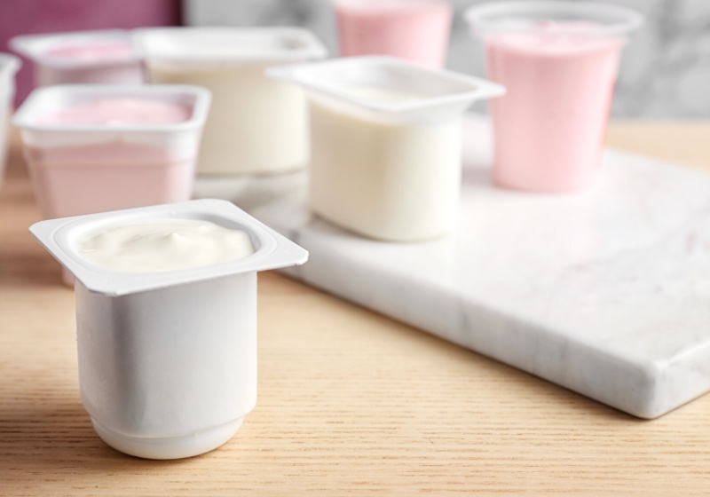 plastic cup tasty yogurt on table | weight loss habits