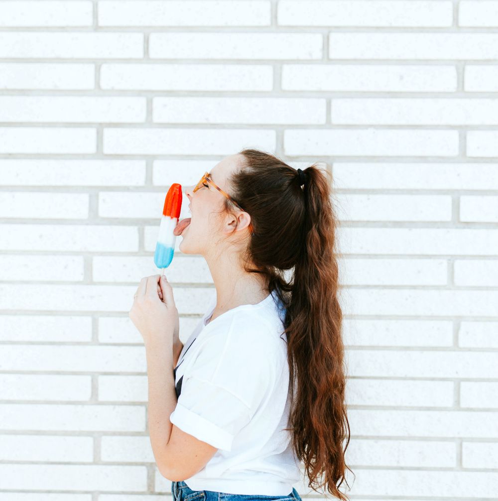 teenage girl licking ice popsicle outdoor | How To Do A High Ponytail That Won't Fall Down | how to do a sleek high ponytail