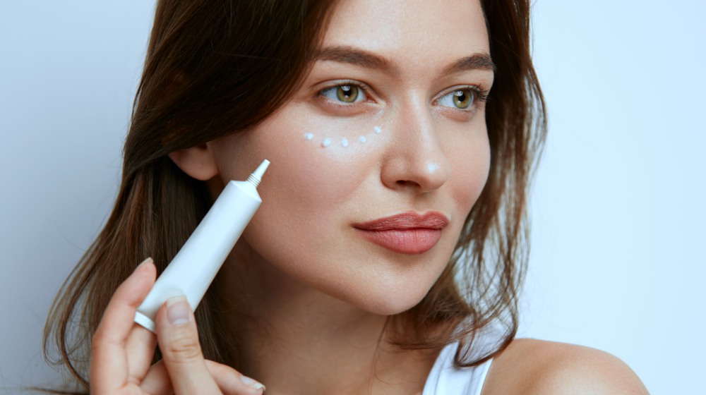 woman applying eye cream | Secrets To Get Glowing Glass Skin | glass skin