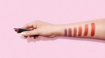 lipstick-swatches-on-woman-hand-holding | Winter Lipstick Shades Your Makeup Bag Needs | Featured