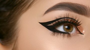 close-up of woman eye with sexy eyeliner and golden shadow | Floating Eyeliner: How To Get The Look (Plus Ideas) | floating eyeliner | floating crease eyeliner | Featured