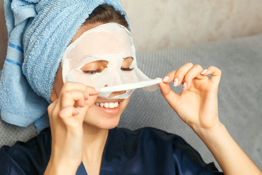 Woman puts nourishing mask on skin for rejuvenating and eliminating defects | 2020 Skincare Trends: Biggest Beauty Innovations To Watch Out For | trends in skin care