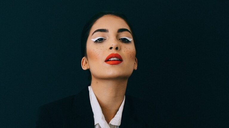 Woman wearing black formal suit jacket with white eyeliner | Wearable High Fashion Spring/Summer Makeup Looks | Featured
