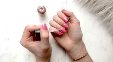 Woman with pink manicure | How To Fix A Broken Nail At Home Using Household Items | how to fix a broken nail with gel polish on | Featured