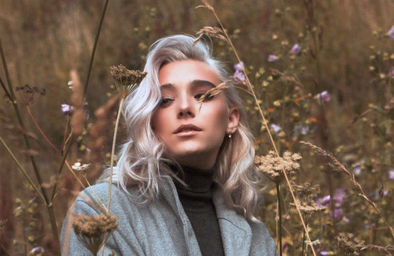 woman wearing a grey cardigan | Trendy Fall Hair Colors To Update Your Look For The Season
