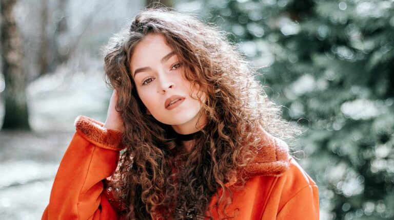 woman in orange zip up jacket | Stunning Ways To Slay Your Fall Look With Brown Lipstick | Featured