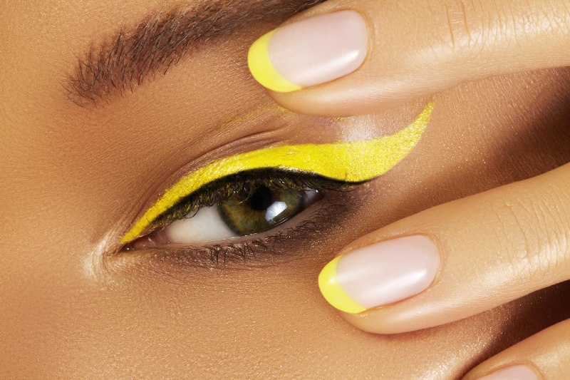 beautiful macro close female eye bright yellow eyeliner makeup | graphic eyeliner tutorial