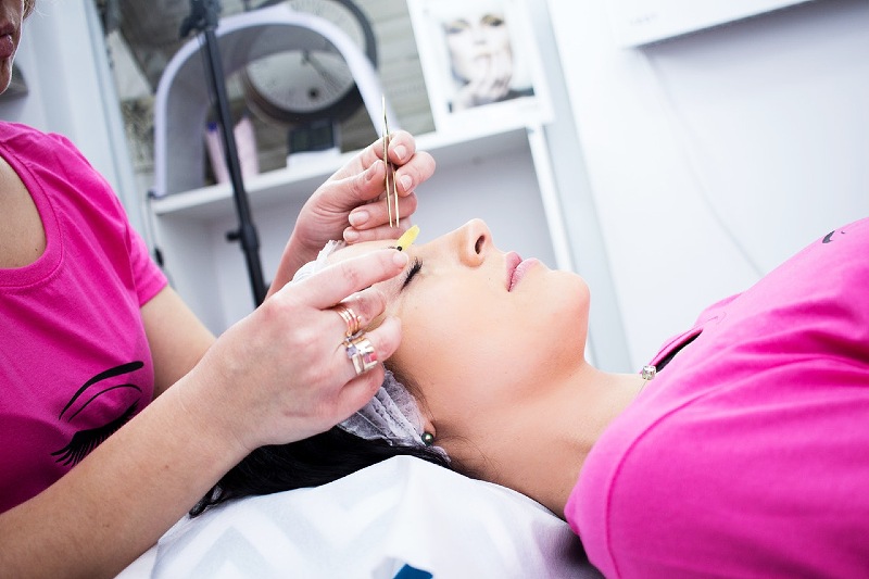 photo of woman having facial care | brow lamination cost