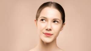 woman with red lipstick looking up | collagen serum firming