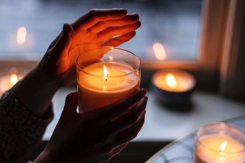 photo of person holding scented candle | luxury soy candles