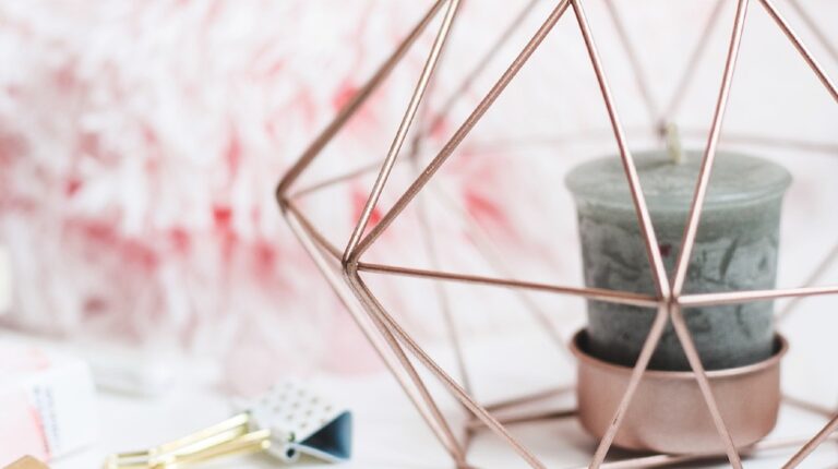 selective focus photography of candle in pink ornate holder | Easy DIY Scented Candles For Your Cozy Vanity Corner | Featured